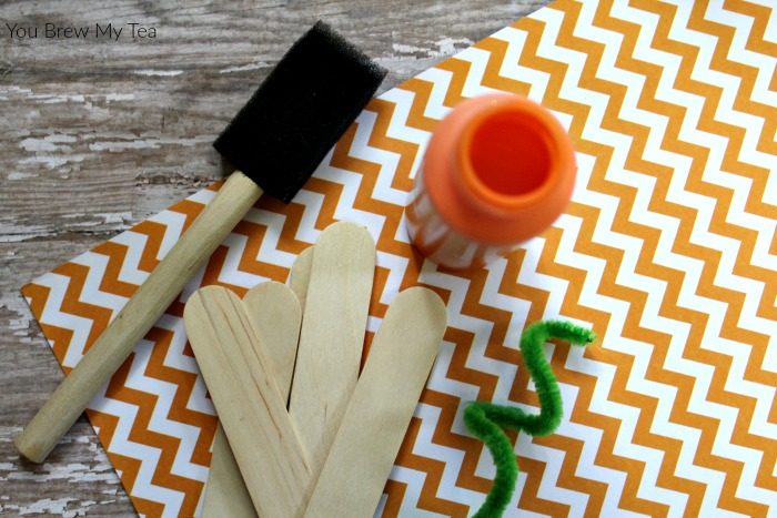 Craft Sticks make the perfect simple Pumpkin Kids Craft! Check out how to put this together to make a fun decoration or magnet for Fall!