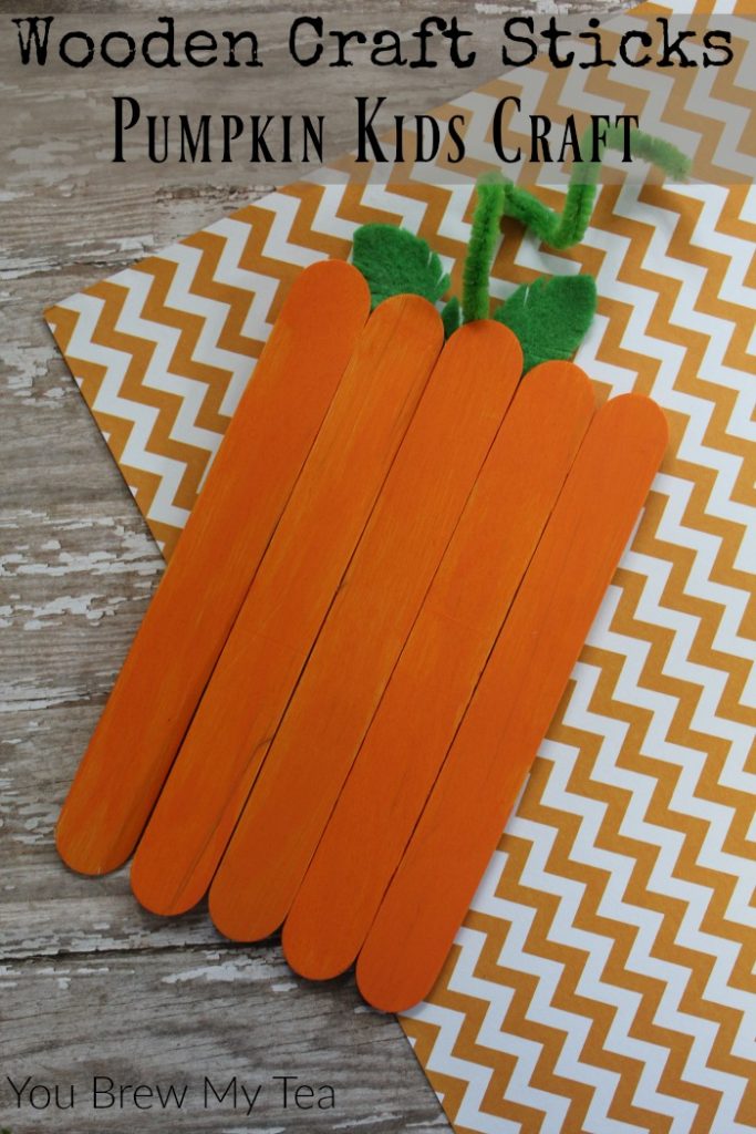 Craft Sticks make the perfect simple Pumpkin Kids Craft! Check out how to put this together to make a fun decoration or magnet for Fall!