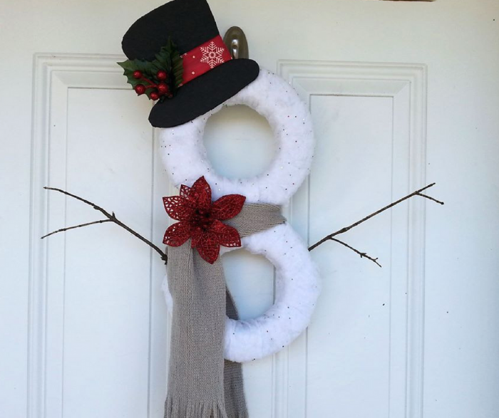 This DIY Snowman Wreath is so easy to put together and a great dollar store craft idea! This is a perfect holiday wreath that is under $5 out of pocket, and works all winter long! 