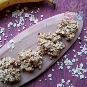 oatmeal cookies on wood tray on pink napkin