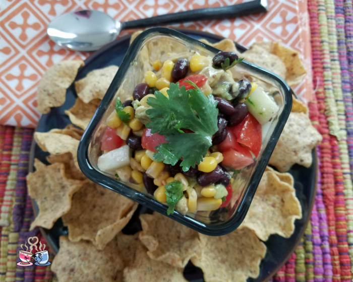 Black Bean and Corn Salad with tomato and avocado is often also called Cowboy Caviar! Check out our Low SmartPoint recipe and easy to make homemade snack!