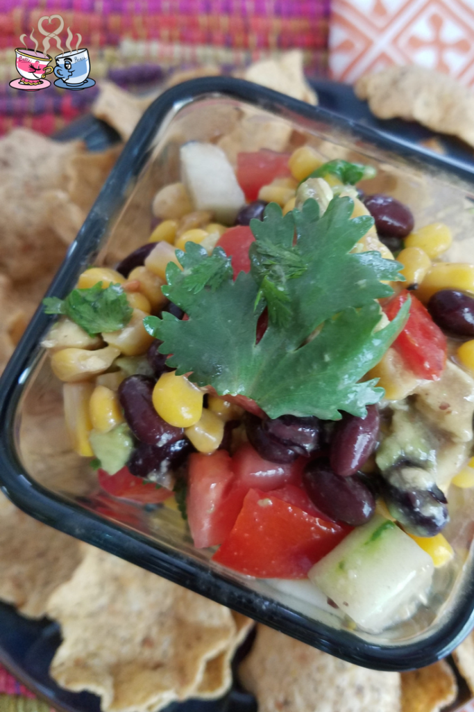 Black Bean and Corn Salad with tomato and avocado is often also called Cowboy Caviar! Check out our Low SmartPoint recipe and easy to make homemade snack!