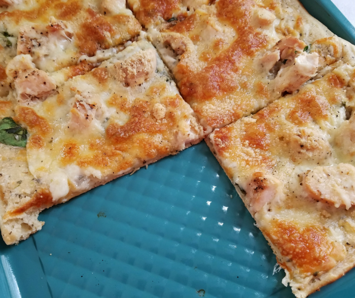 Make our Weight Watchers FreeStyle Recipe for Skinny Chicken Alfredo Pizza! This is so easy, delicious, and kid-friendly! A perfect Weight Watchers pizza recipe!