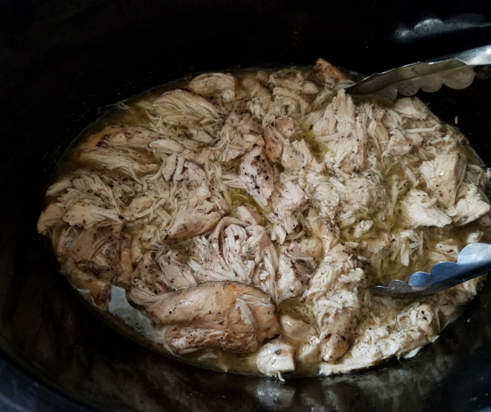 Make our Slow Cooker Greek Chicken for only 1 FreeStyle SmartPoint on Weight Watchers! This delicious flavorful recipe is so easy to make and flexible for salads, sandwiches, and more!