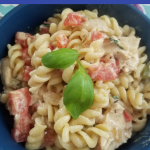 Creamy Chicken Pasta with Basil and Tomatoes is a light, fresh, pasta dish that satisfies your cravings! With only 9 Smartpoints per serving on the WW FreeStyle plan, it easily fits into your WW meal plan. Make this Weight Watchers Pasta Recipe for your family in under 30 minutes tonight!