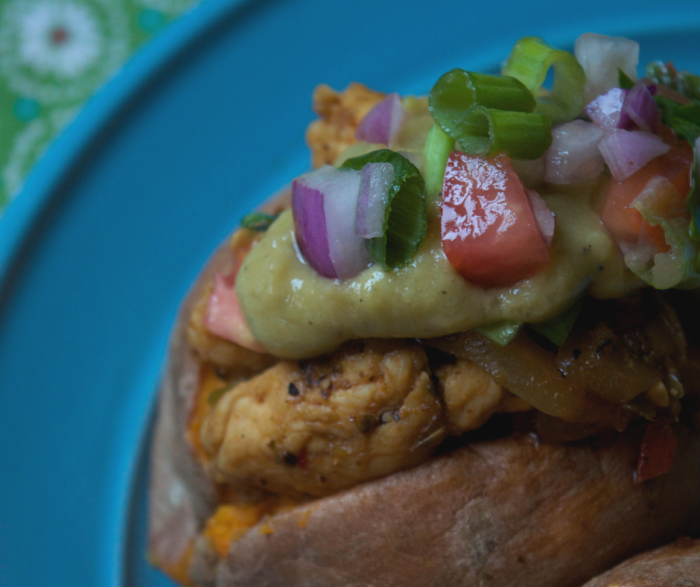 Make my Baked Chicken Fajita Loaded Sweet Potato for a super easy and low point meal that everyone in your house will love. This stuffed sweet potato recipe contains zero point baked chicken fajitas and a yummy low point avocado sauce that makes the flavors pop!