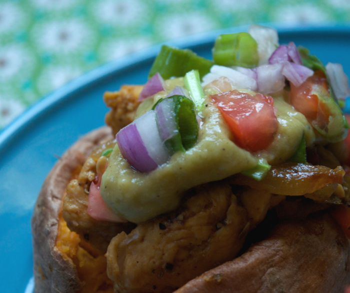 Make my Baked Chicken Fajita Loaded Sweet Potato for a super easy and low point meal that everyone in your house will love. This stuffed sweet potato recipe contains zero point baked chicken fajitas and a yummy low point avocado sauce that makes the flavors pop!