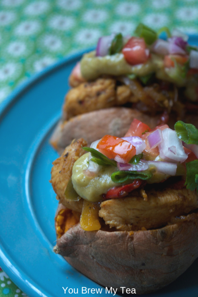 Make my Baked Chicken Fajita Loaded Sweet Potato for a super easy and low point meal that everyone in your house will love. This stuffed sweet potato recipe contains zero point baked chicken fajitas and a yummy low point avocado sauce that makes the flavors pop!