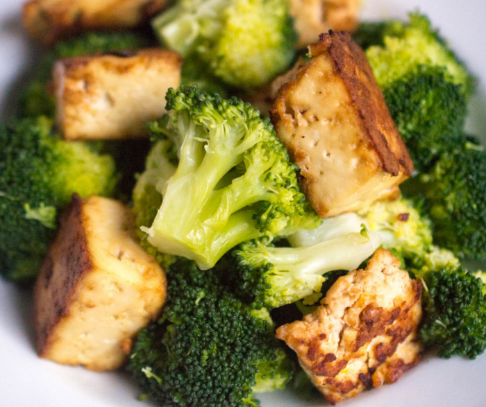 Up close image of a white bowl or plate filled with crispy tofu and broccoli