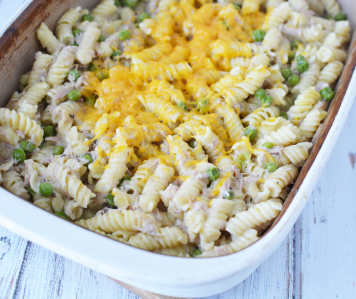 Up close image of tuna noodle casserole recipe in clay cookware on a wooden table