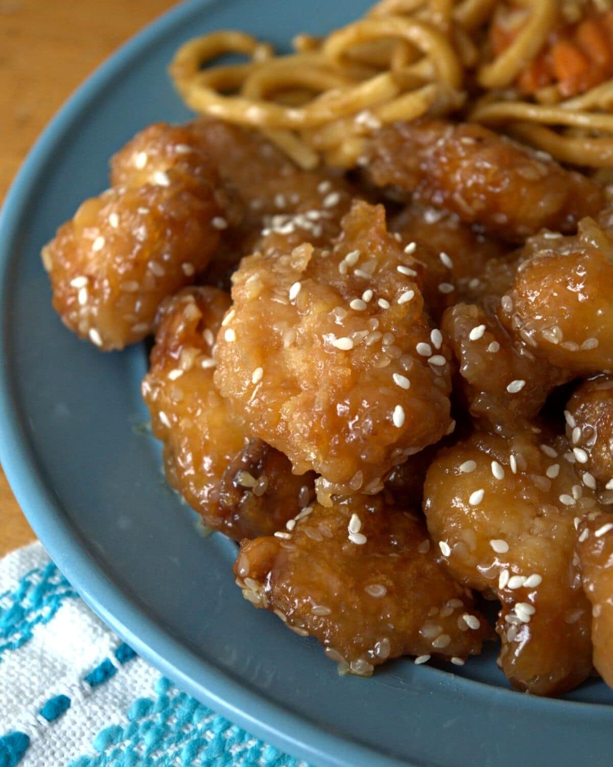 weight watchers sesame chicken on blue plate with pasta