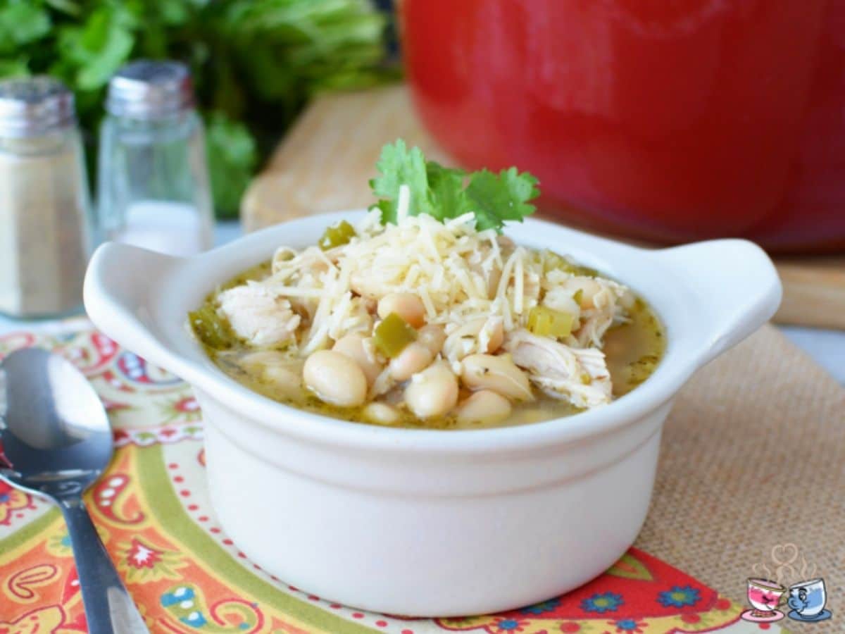 white bowl of turkey chili on orange and green napkin