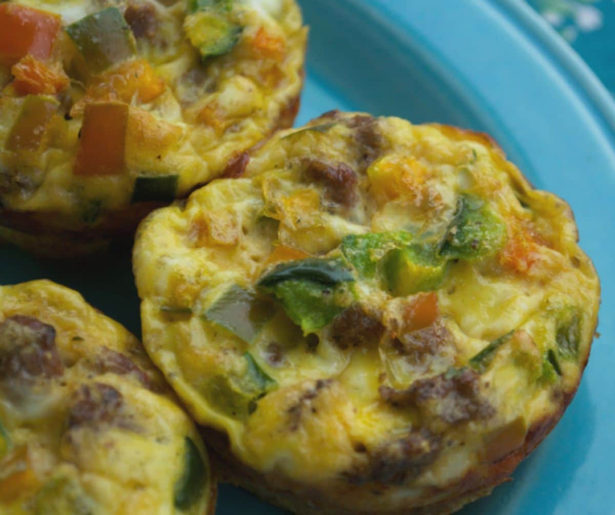 egg muffins with bell pepper on teal plate