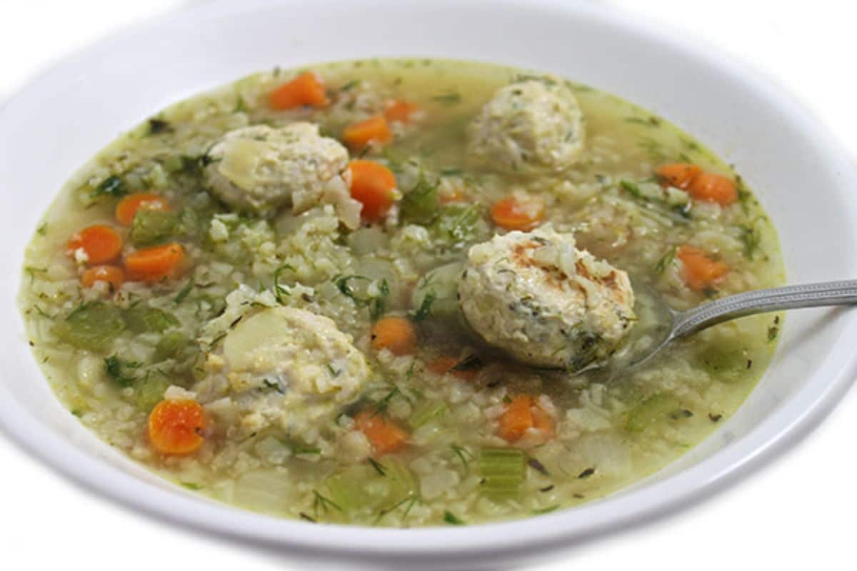 white bowl of soup with meatballs