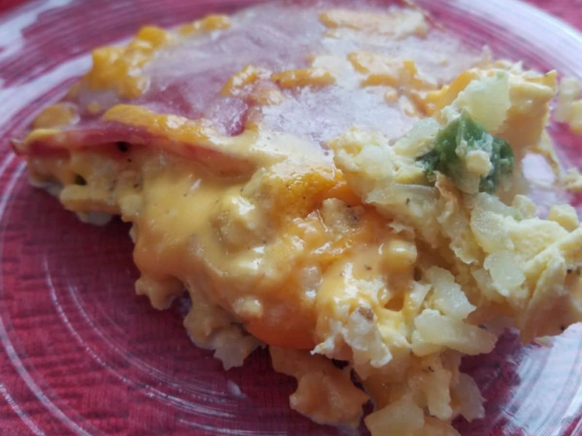 hashbrown and ham casserole on red plate