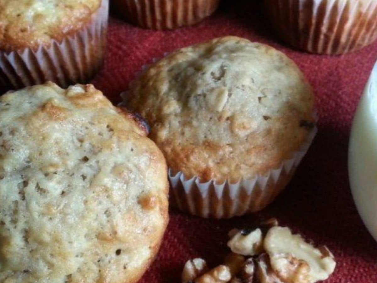 muffins by walnuts on red napkin 