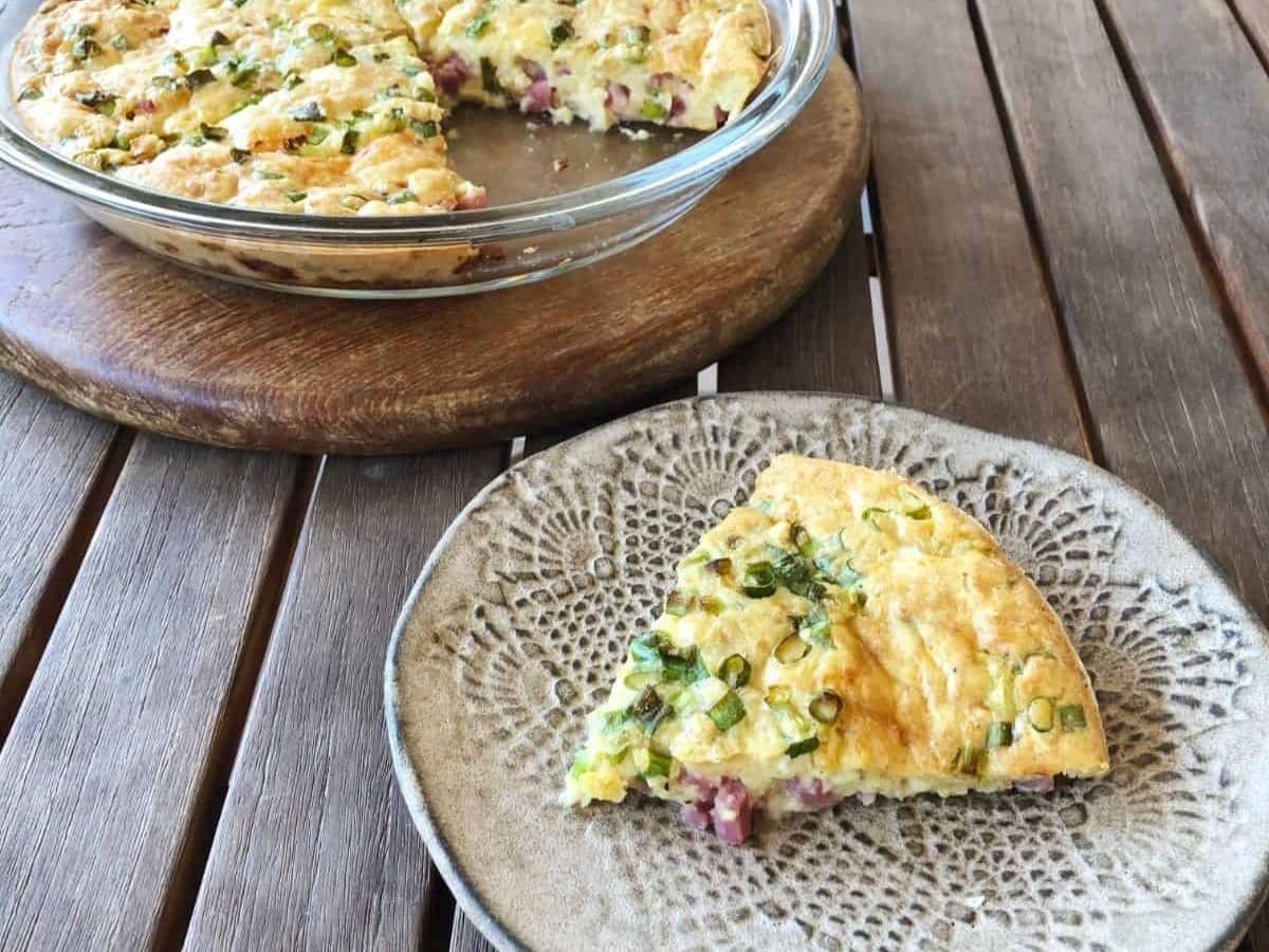 slice of strata on marbled plate by pie plate