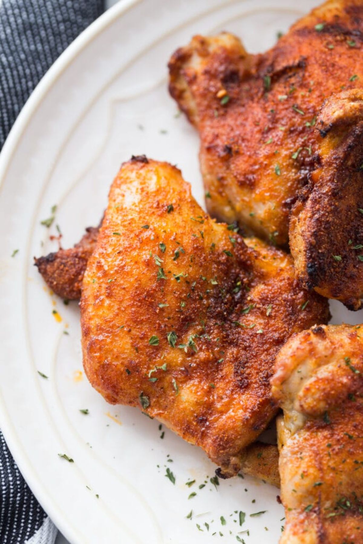 fried chicken thighs on white plate