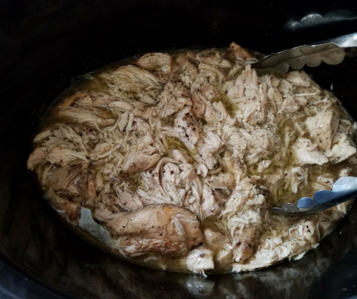 chicken in sauce in black crockpot