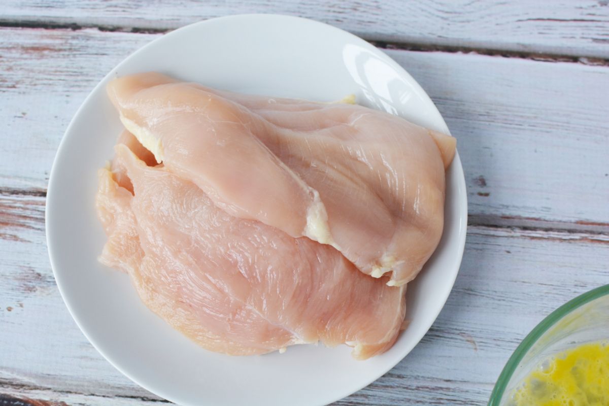 thin sliced chicken breasts on white plate