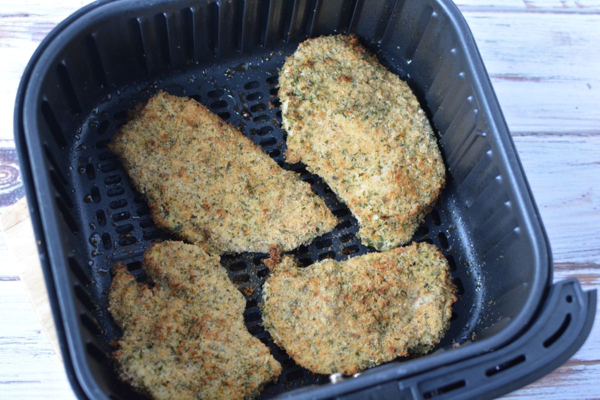cooked coated chicken in air fryer basket