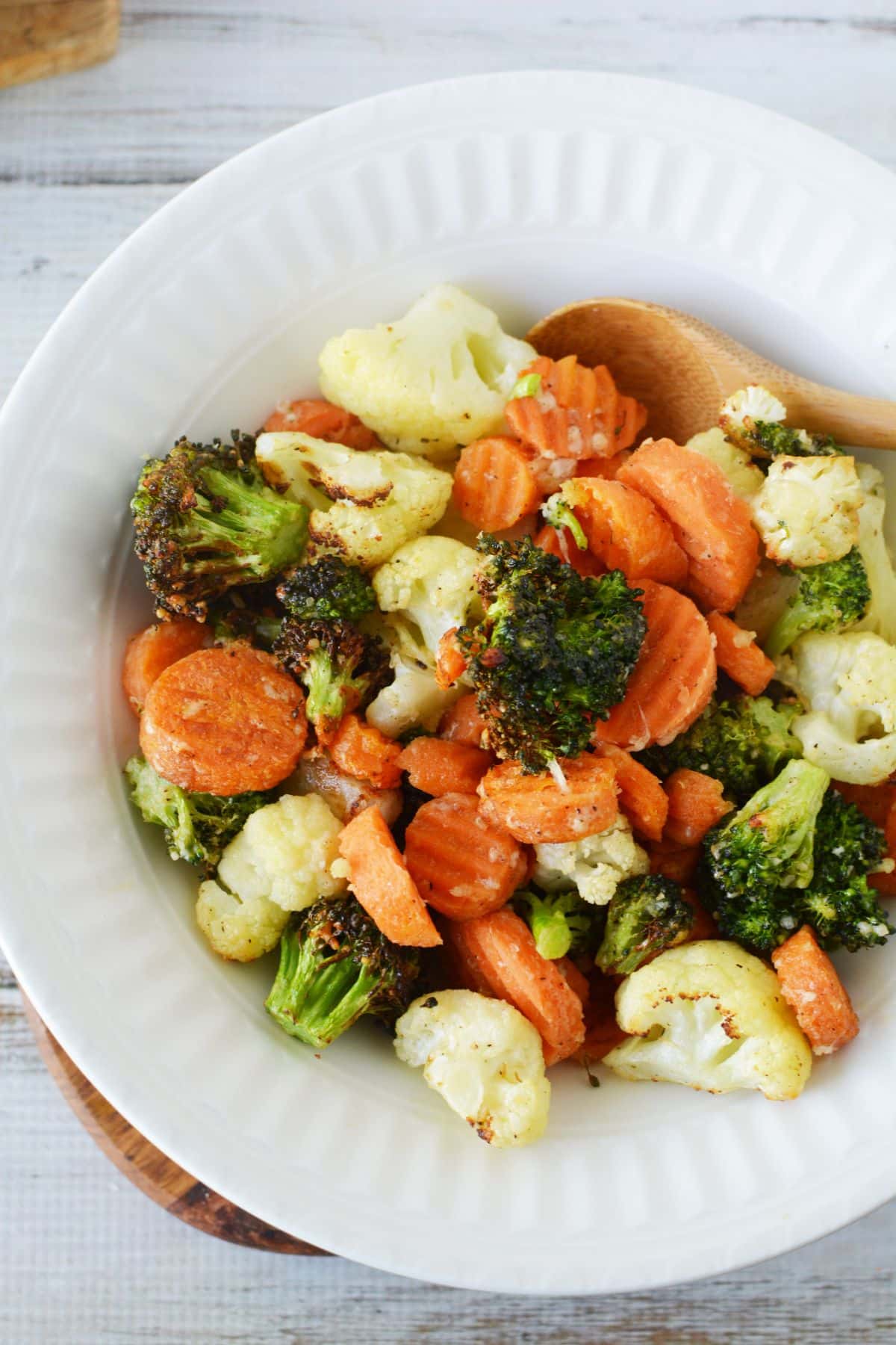 large white bowl of air fryer roasted vegetables