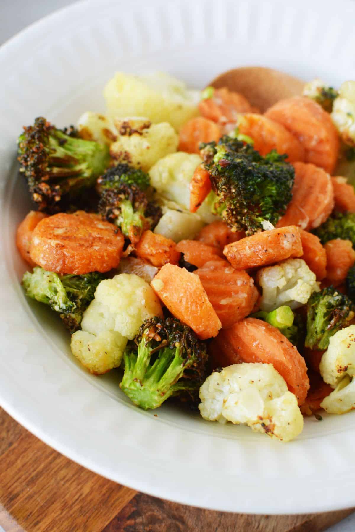 air fryer vegetables with parmesan in white bowl