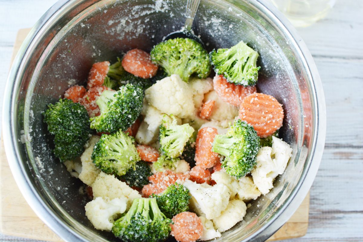 stainless steel bowl of vegetables before roasting